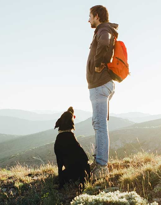 man outdoors with dog