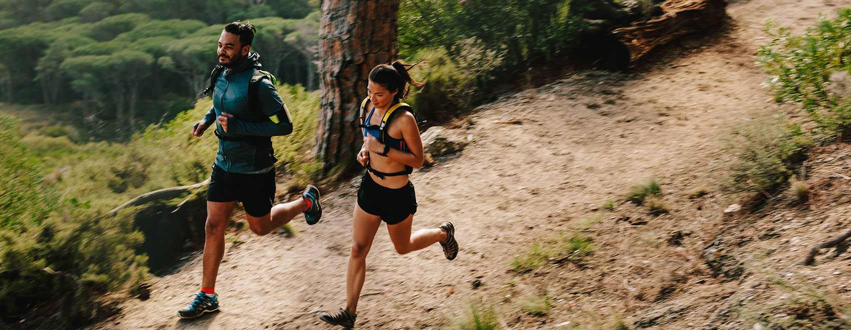 Young couple doing trail running workout