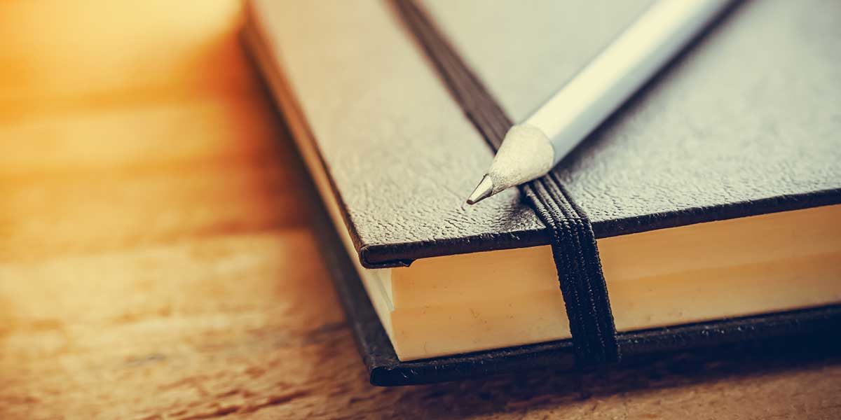 journal and pencil on desk